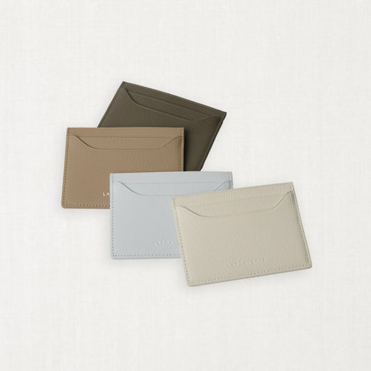 Labovarde Slim Card Wallets in Assorted Colors — Flat lay view of four wallets arranged on a white background