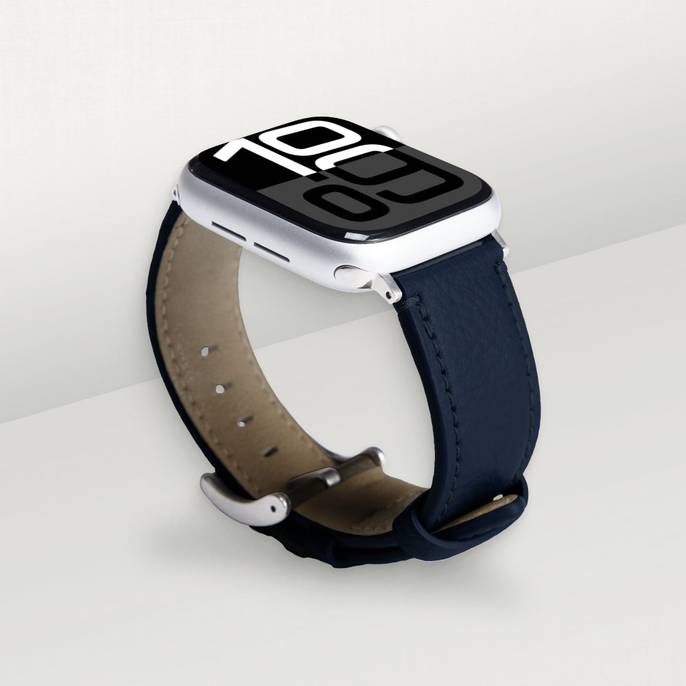 Labovarde Apple Watch band in navy — angled view showing the beige lining and silver buckle