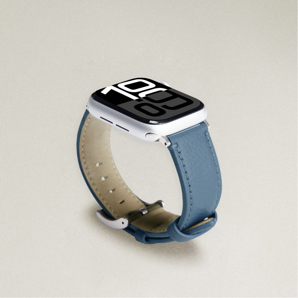 Labovarde Apple Watch band in Pale Blue — angled view showing the beige lining and silver buckle