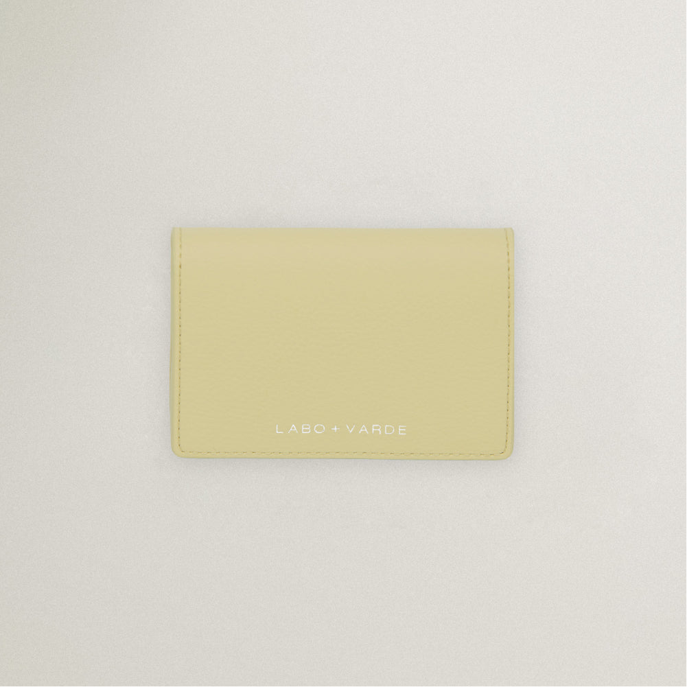 Labovarde Business Card Holder in Light Yellow — Top-down view showing the silver debossed logo