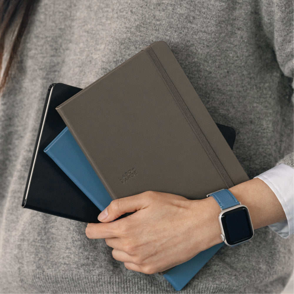 Labovarde Business Diary in Etoupe, pale-blue, and Black — Stacked close-up showing the elastic bands and debossed logo