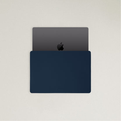 Labovarde Laptop Sleeve in Navy — Top view with a space gray MacBook partially inserted to show the sleek fit