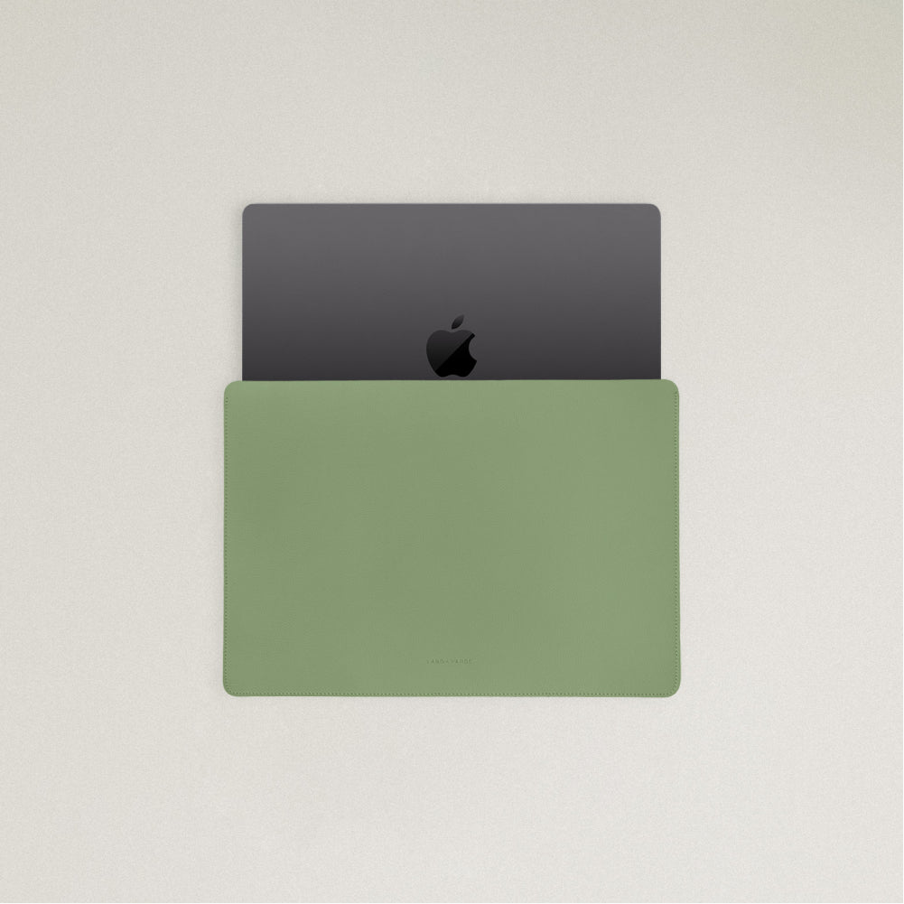 Labovarde Laptop Sleeve in Sage Green — Top view with a space gray MacBook partially inserted to show the sleek fit
