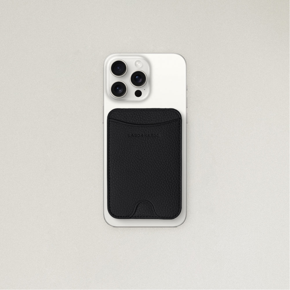 Labovarde MagSafe Card Wallet in Black — Attached to a white iPhone, showing the magenetic fit and debossed logo