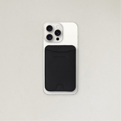 Labovarde MagSafe Card Wallet in Black — Attached to a white iPhone, showing the magenetic fit and debossed logo
