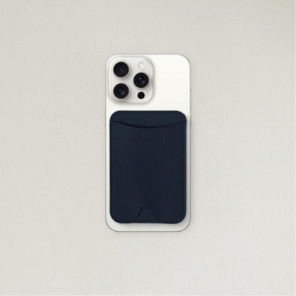 Labovarde MagSafe Card Wallet in Navy — Attached to a white iPhone, showing the magenetic fit and debossed logo