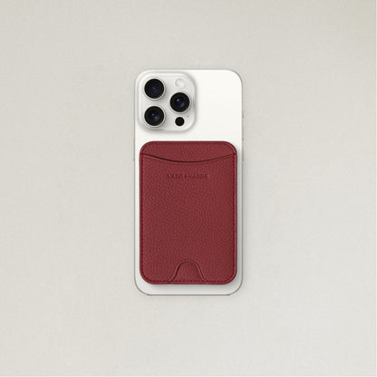 Labovarde MagSafe Card Wallet in Red — Attached to a white iPhone, showing the magenetic fit and debossed logo