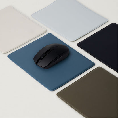 Labovarde Mouse Pad in Assorted Colors — With a black mouse on a pale-blue pad, surrounded by multi-color options
