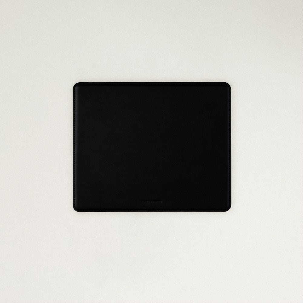 Labovarde Mouse Pad in Black — Flat lay view of the mouse pad centered on a light gray background
