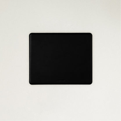 Labovarde Mouse Pad in Black — Flat lay view of the mouse pad centered on a light gray background