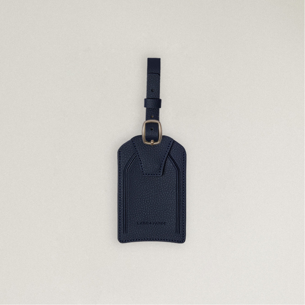 Labovarde Name Tag in Navy — Front view centered on a minimalist textured white background