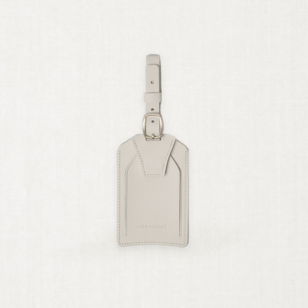 Labovarde Name Tag in Sand Gray — Front view centered on a minimalist textured white background