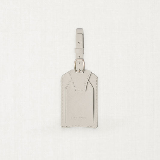 Labovarde Name Tag in Sand Gray — Front view centered on a minimalist textured white background