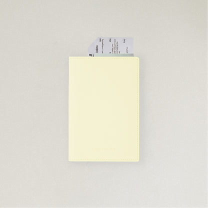 Labovarde Passport Case in Light Yellow — front view showing passport cover and Tickets in Case on a white Background