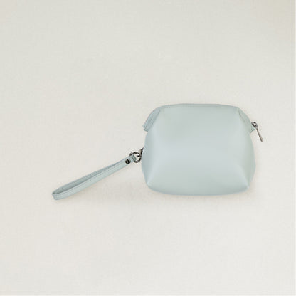Labovarde Shell Pouch Bag in Clear Blue — Clean front view highlighting the top zipper closure and convenient wristlet strap.